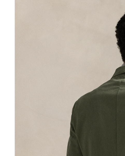 Our Polo Soft jacket puts a modern spin on classic preppy style with a natural shoulder, a slightly structured chest and partial lining. This double-breasted version is tailored in Portugal with a custom-developed chino cloth that is woven with stretch for added comfort. A garment-dye process adds subtle tonal variation.