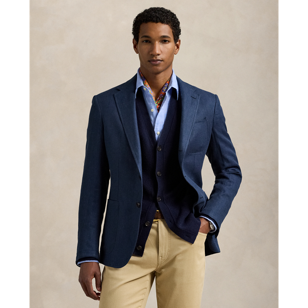 Our Polo blazer offers more structure in the chest and shoulders. This version is tailored in Portugal from a lightweight tweed cloth that was custom-woven with fine linen and wool.
