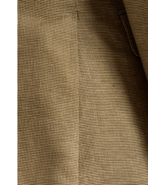 Our Polo blazer offers more structure in the chest and shoulders. This tick-weave version is tailored from a custom-developed fabric woven with lightweight linen and wool.