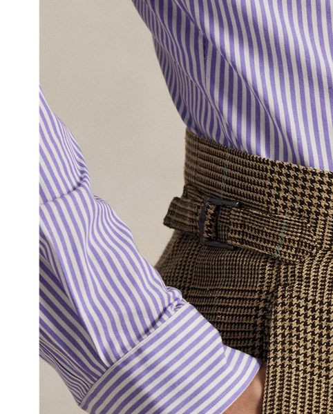 Distinguished by custom-developed Italian tweed, these pleated trousers showcase  Ralph Lauren Lauren's commitment to exceptional craftsmanship. The luxurious blend of fine wool and silk creates a rich textural depth, while expert tailoring ensures an impeccable fit, which exemplifies timeless sophistication.