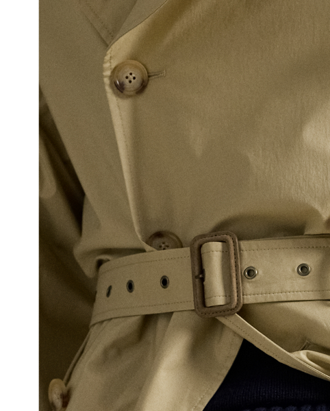 Masterfully crafted in Italy, this distinguished trench coat embodies  Ralph Lauren Lauren's commitment to timeless style and superior crafting. Its stretch cotton poplin is treated with a water-repellent finish, while suede-covered buckles add a textural contrast.