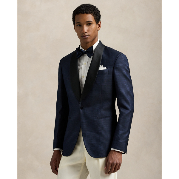 Our Polo jacket offers more structure in the chest and shoulders along with a full lining. This tuxedo version is meticulously tailored in Italy from a jacquard cloth that was woven with a tonal plaid motif. The luxurious fabric was custom-developed with a centuries-old English mill using a blend of silk, wool and cotton.