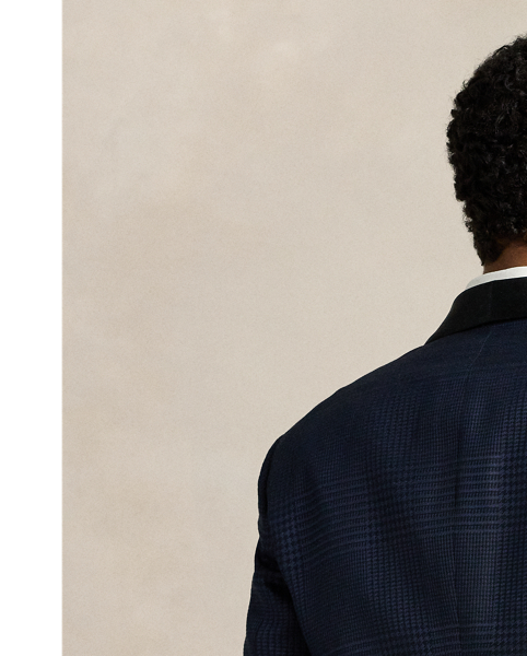 Our Polo jacket offers more structure in the chest and shoulders along with a full lining. This tuxedo version is meticulously tailored in Italy from a jacquard cloth that was woven with a tonal plaid motif. The luxurious fabric was custom-developed with a centuries-old English mill using a blend of silk, wool and cotton.