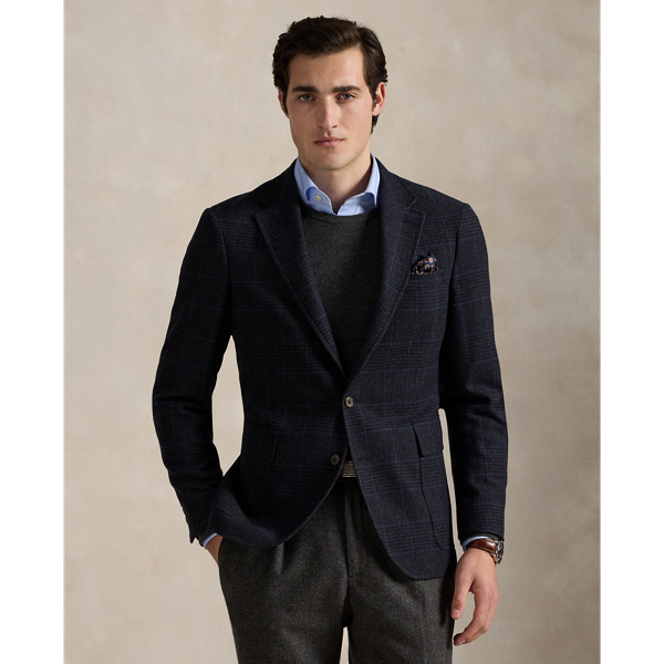 Our Polo sport coat offers more structure in the chest and shoulders along with full lining. This version is tailored with a custom-developed wool-blend cloth and features a classic Glen plaid pattern that is punctuated with a subtle blue overcheck.
