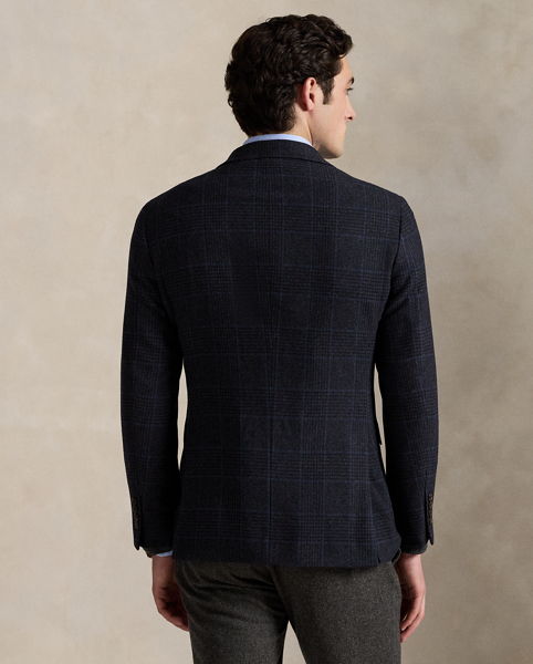 Our Polo sport coat offers more structure in the chest and shoulders along with full lining. This version is tailored with a custom-developed wool-blend cloth and features a classic Glen plaid pattern that is punctuated with a subtle blue overcheck.