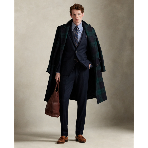 These pleated trousers are expertly tailored from a knit interpretation of woven flannel, which provides inherent stretch and an elegant drape. The custom-developed cloth includes wool and cotton, allowing for both breathability and warmth.