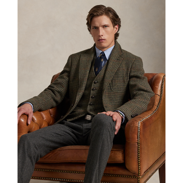 Our Polo blazer offers more structure in the chest and shoulders along with a full lining. This Glen plaid version is expertly tailored using a wool tweed fabric that was custom-developed with a storied Scottish mill. At the elbows and undercollar, it is detailed with velvety suede.