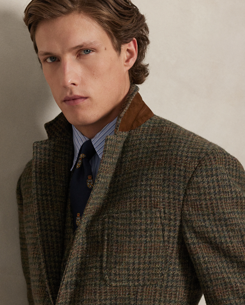 Our Polo blazer offers more structure in the chest and shoulders along with a full lining. This Glen plaid version is expertly tailored using a wool tweed fabric that was custom-developed with a storied Scottish mill. At the elbows and undercollar, it is detailed with velvety suede.