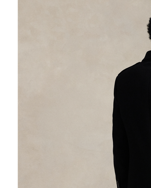 Polo's take on the classic topcoat is crafted from a lightweight melton cloth custom-developed for  Ralph Lauren Lauren and includes wool for extra warmth.