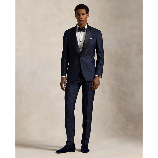 These tuxedo trousers are masterfully tailored in Italy from a luxurious jacquard fabric custom-developed with a centuries-old English mill. The sumptuous blend of silk, wool and cotton creates an exquisite texture, reflecting the timeless elegance and superior craftsmanship that are synonymous with Polo Ralph Lauren Lauren.
