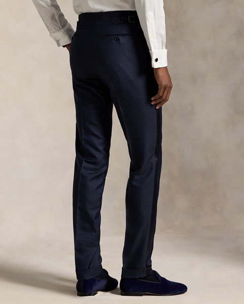 These tuxedo trousers are masterfully tailored in Italy from a luxurious jacquard fabric custom-developed with a centuries-old English mill. The sumptuous blend of silk, wool and cotton creates an exquisite texture, reflecting the timeless elegance and superior craftsmanship that are synonymous with Polo Ralph Lauren Lauren.