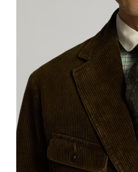 Notch-lapel blazer made from wide-wale cotton corduroy. Four pockets on the front. Half-lined. Heavily washed. Corozo buttons.