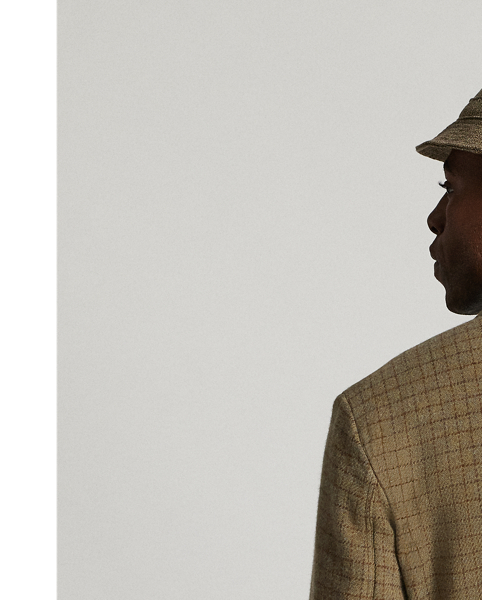 Notch-lapel blazer. Checked wool tweed was custom-developed with an Italian mill. Fibre-dyed mélange fabric features an open-weave construction. Half-lined. Corozo buttons.