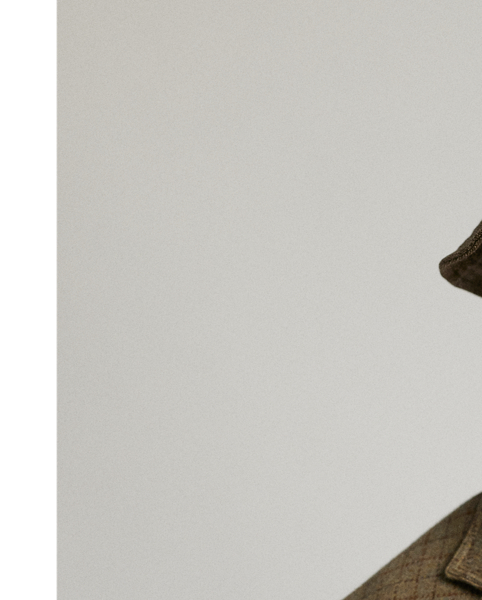 Notch-lapel blazer. Checked wool tweed was custom-developed with an Italian mill. Fibre-dyed mélange fabric features an open-weave construction. Half-lined. Corozo buttons.