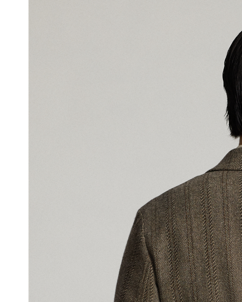 Notch-lapel sport coat. Wool-and-cotton herringbone twill was custom-developed with a storied British mill. Yarn-dyed stripe pattern. half-lined. Corozo buttons.