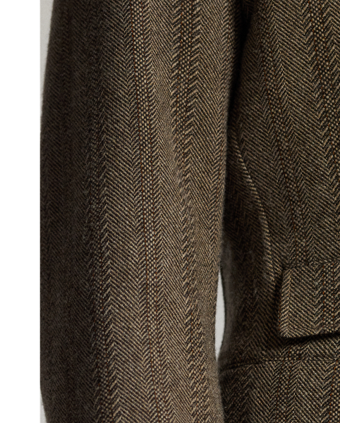 Notch-lapel sport coat. Wool-and-cotton herringbone twill was custom-developed with a storied British mill. Yarn-dyed stripe pattern. half-lined. Corozo buttons.