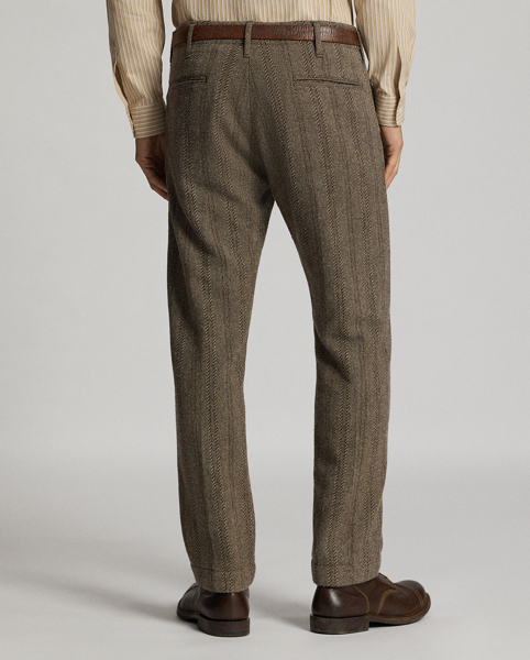 Trim-fitting trousers with a straight leg. Wool-and-cotton herringbone twill was custom-developed with a storied British mill. Yarn-dyed stripe pattern. Corozo buttons.