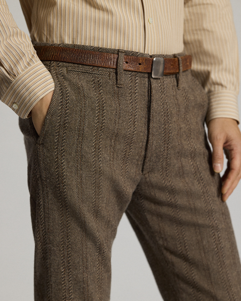 Trim-fitting trousers with a straight leg. Wool-and-cotton herringbone twill was custom-developed with a storied British mill. Yarn-dyed stripe pattern. Corozo buttons.
