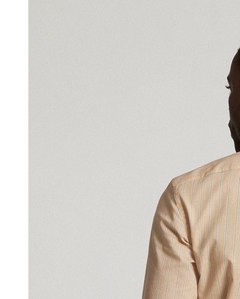 Slim-fitting shirt made from a printed woven cloth inspired by an antique textile. Vintage-style contrasting straight collar. Patch pocket on the left chest. Genuine mother-of-pearl buttons.