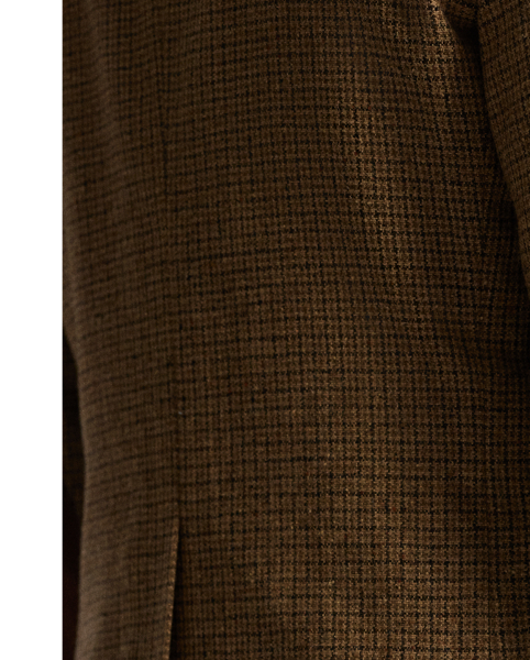 Notch-lapel jacket tailored in Italy. Checked wool cloth was custom-developed with a storied Irish mill. Suede elbow patches. Buttoned throat latch. Half-lined. Genuine horn buttons.
