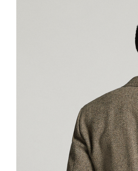 Notch-lapel jacket tailored in Italy. Fibre-dyed wool dobby cloth was custom-developed with an Italian mill. half-lined. Genuine horn buttons.