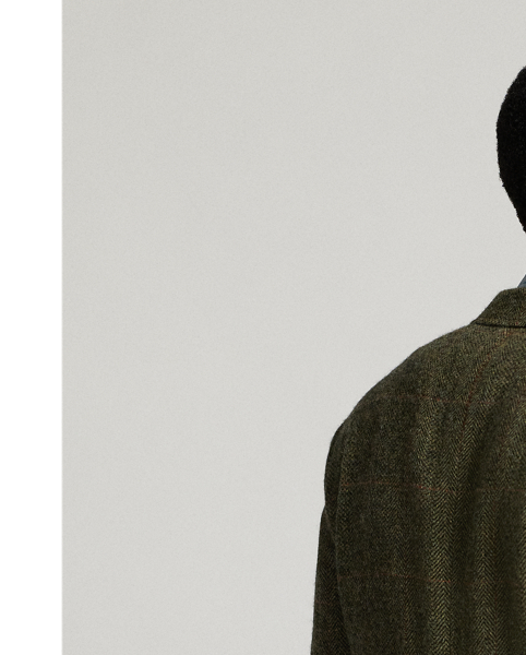 Notch-lapel jacket tailored in Italy. Wool herringbone cloth with a windowpane pattern. The cloth used in these trousers has been custom-developed with a storied Irish mill. Belted back. half-lined. Genuine horn buttons.