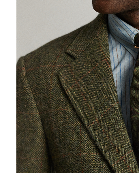 Notch-lapel jacket tailored in Italy. Wool herringbone cloth with a windowpane pattern. The cloth used in these trousers has been custom-developed with a storied Irish mill. Belted back. half-lined. Genuine horn buttons.