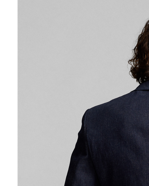 Tuxedo jacket tailored in Italy. Custom-developed Japanese denim woven with a stretch cotton blend featuring linen and ramie. Dyed with indigo. Satin peak lapels. Half-lined.
