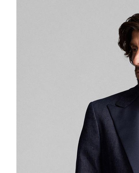 Tuxedo jacket tailored in Italy. Custom-developed Japanese denim woven with a stretch cotton blend featuring linen and ramie. Dyed with indigo. Satin peak lapels. Half-lined.