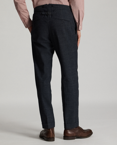 Slim-fitting trousers tailored in Italy. Indigo-dyed herringbone cloth is custom-developed with a Japanese mill. Subtle micro-check pattern is over-printed with a windowpane motif. half-lined.