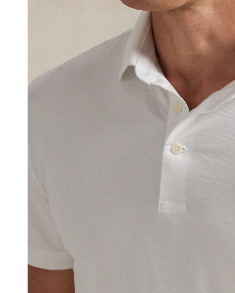 This stretch piqué Polo shirt is developed with moisture-wicking properties for enhanced comfort and features our iconic Polo Bear embroidered on the chest.