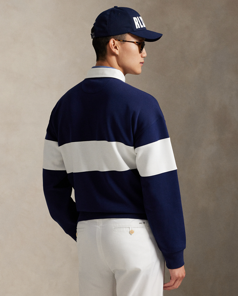 Crafted from water-repellent double-knit fabric, this layer combines the look of a rugby shirt with the lightweight warmth of a sweatshirt. It features an "RLX" shield crest with crossed golf clubs intricately embroidered at the front.
