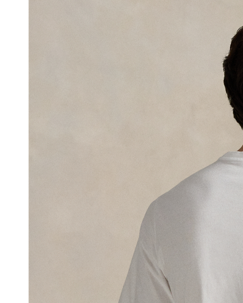 Designed for our 2025 US Ryder Cup Team Collection, this cotton jersey T-shirt features our beloved Polo Bear wearing a version of our Iconic Flag Jumper, which we updated specifically for the players' uniform. Behind our mascot is the famous sign at Bethpage Black Golf Course, which cautions players of its immense difficulty and is a landmark at the location of this year's tournament. Many start their rounds with a photo by the sign – now a nationally known symbol, as our Polo Bear does here.