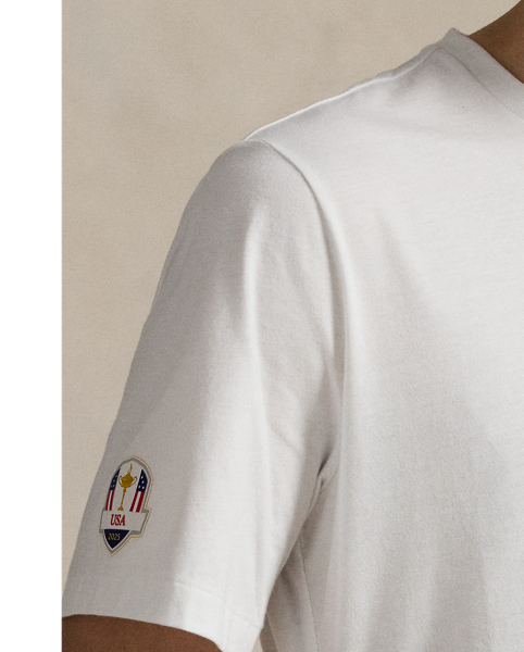 Designed for our 2025 US Ryder Cup Team Collection, this cotton jersey T-shirt features our beloved Polo Bear wearing a version of our Iconic Flag Jumper, which we updated specifically for the players' uniform. Behind our mascot is the famous sign at Bethpage Black Golf Course, which cautions players of its immense difficulty and is a landmark at the location of this year's tournament. Many start their rounds with a photo by the sign – now a nationally known symbol, as our Polo Bear does here.