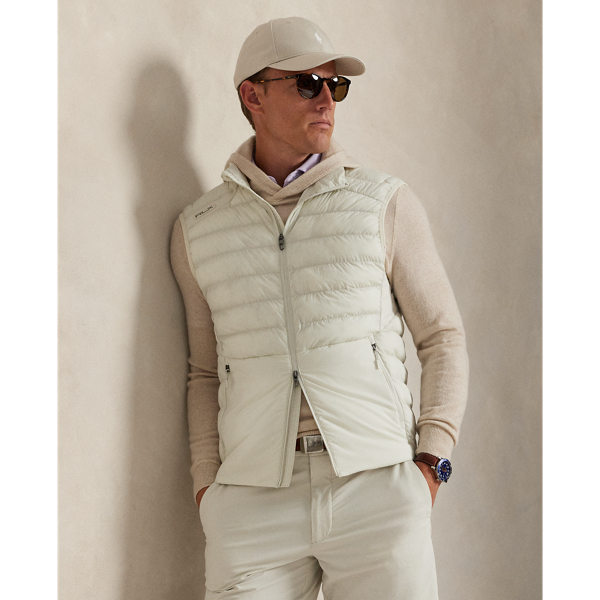 Crafted from water-repellent fabric, this lightweight gilet is ergonomically panelled with stretch jersey for ease of movement and insulated with down-alternative fill. It features slots on the waist pockets for hand warmers as well as a scorecard compartment in the interior.