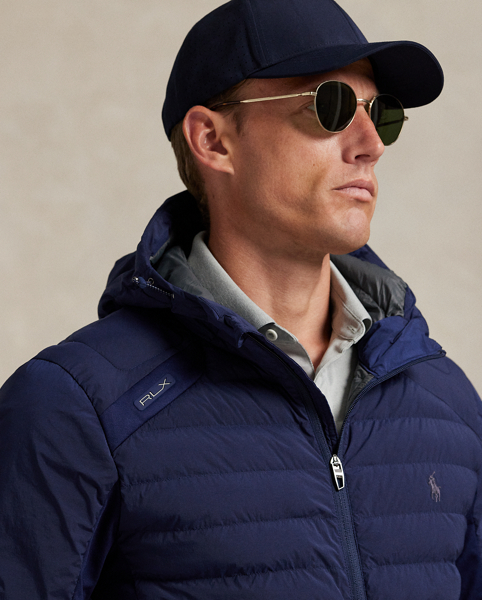 Crafted from water-repellent fabric, this lightweight jacket is ergonomically panelled with stretch jersey for ease of movement and insulated with down-alternative fill. It features slots on the waist pockets for hand warmers as well as a scorecard compartment on the interior.
