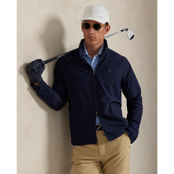 This lightweight jacket is thoughtfully engineered for breathability and comfort with stretch mesh inserts on the sleeves and vented sides. In addition to a stowaway hood, it features reflective detailing on the back.