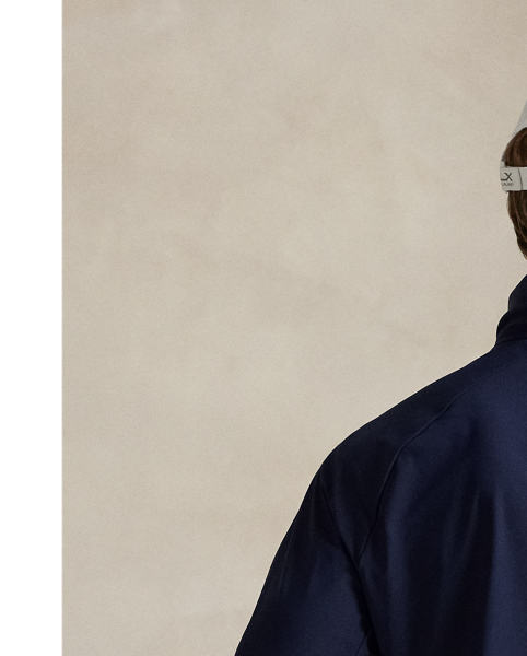 This lightweight jacket is thoughtfully engineered for breathability and comfort with stretch mesh inserts on the sleeves and vented sides. In addition to a stowaway hood, it features reflective detailing on the back.