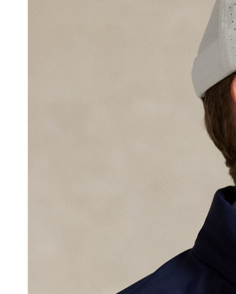 This lightweight jacket is thoughtfully engineered for breathability and comfort with stretch mesh inserts on the sleeves and vented sides. In addition to a stowaway hood, it features reflective detailing on the back.