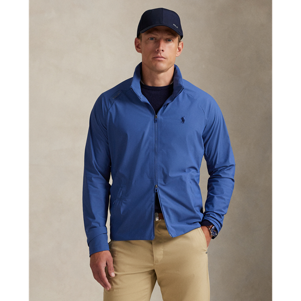 This lightweight jacket is thoughtfully engineered for breathability and comfort with stretch mesh inserts on the sleeves and vented sides. In addition to a stowaway hood, it features reflective detailing on the back.