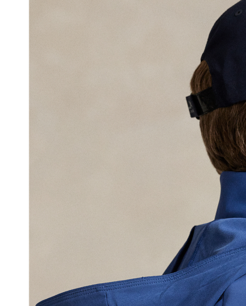 This lightweight jacket is thoughtfully engineered for breathability and comfort with stretch mesh inserts on the sleeves and vented sides. In addition to a stowaway hood, it features reflective detailing on the back.