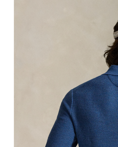 This jumper combines a silhouette inspired by our timeless Polo shirt with moisture-wicking COOLMAX fibres to help keep you cool, dry and comfortable. It is knit using a piqué stitch for subtle texture and finished with genuine mother-of-pearl buttons, which we have custom-developed with our logo.