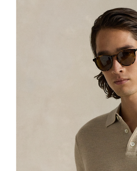 This jumper combines a silhouette inspired by our timeless Polo shirt with moisture-wicking COOLMAX fibres to help keep you cool, dry and comfortable. It is knit using a piqué stitch for subtle texture and finished with genuine mother-of-pearl buttons, which we have custom-developed with our logo.