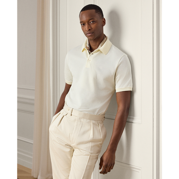 Crafted in Italy, the Purple Label Polo shirt is the ultimate in casual luxury. Its lightweight fabric is knit with premium cotton and double-mercerised to enhance its strength and colour retention. " Ralph Lauren Lauren"-debossed buttons made from genuine mother-of-pearl and our stacked RL logo complete this modern icon.