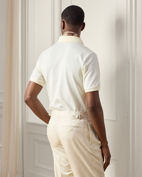 Crafted in Italy, the Purple Label Polo shirt is the ultimate in casual luxury. Its lightweight fabric is knit with premium cotton and double-mercerised to enhance its strength and colour retention. " Ralph Lauren Lauren"-debossed buttons made from genuine mother-of-pearl and our stacked RL logo complete this modern icon.