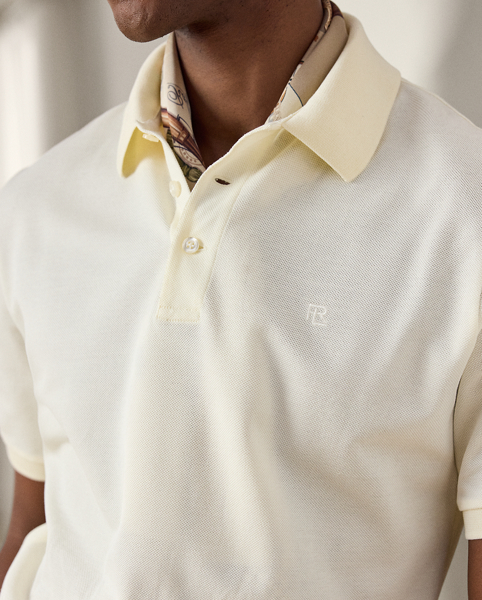 Crafted in Italy, the Purple Label Polo shirt is the ultimate in casual luxury. Its lightweight fabric is knit with premium cotton and double-mercerised to enhance its strength and colour retention. " Ralph Lauren Lauren"-debossed buttons made from genuine mother-of-pearl and our stacked RL logo complete this modern icon.