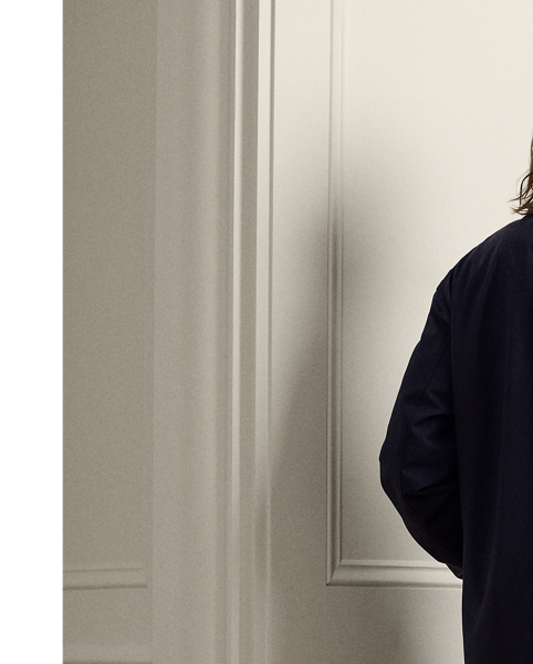 This car coat is crafted in Italy with a coated wool-blend fabric that is both water- and wind-resistant. Inspired by utilitarian overcoats, the lightweight layer is lined at the body with warm brushed flannel.