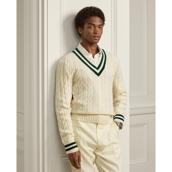 The cricket jumper is defined by its cable-knit pattern, usually in cream, as well as its V-neck and striped trim.  Ralph Lauren Lauren introduced his version in 1972 and this Purple Label rendition elevates the iconic characteristics with thick-gauge cashmere yarns and expert Italian crafting.