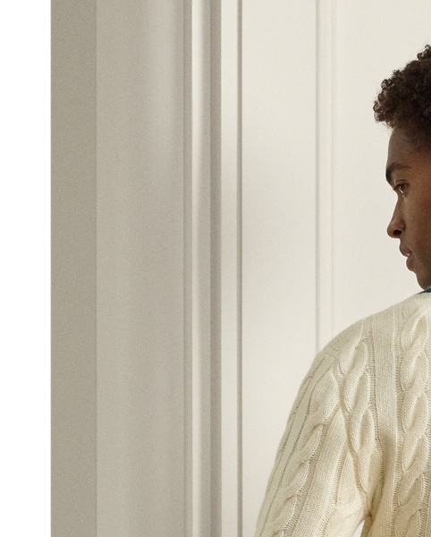 The cricket jumper is defined by its cable-knit pattern, usually in cream, as well as its V-neck and striped trim.  Ralph Lauren Lauren introduced his version in 1972 and this Purple Label rendition elevates the iconic characteristics with thick-gauge cashmere yarns and expert Italian crafting.