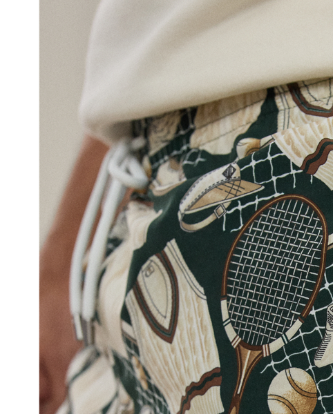 Defined by a relaxed silhouette, the Amalfi is crafted in Italy with a fine fabric that is also used for its travel pouch. Its lightweight cloth was custom-developed with Mantero, a Como-based mill that is renowned for its striking prints. The motif of tennis apparel and equipment draws inspiration from one of our vintage ties and has become a  Ralph Lauren Lauren signature.